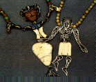 Pair of Puppet Necklaces, silver and shell;   bronze, pipestone and fossilized ivory